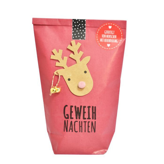 Wundertüte in rot mit Elch drauf und Geweihnachten bestempelt als lustiges weihnachtsgeschenk
